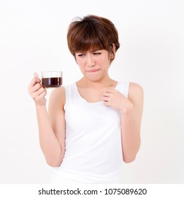 Beautifulyoung Asia woman with a cup of hot coffee. Isolated on white background. Studio lighting. Concept for healthy.