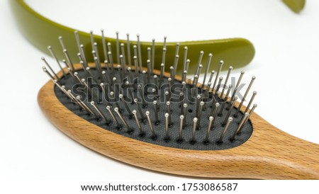 Beauty accessories. isolated of Hairband and Wooden massage hair brush with Metal Pins on white background.