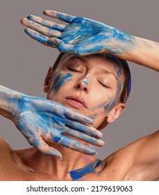 Beauty Art Portrait Of Woman With Interesting Abstract Makeup. Bright, Fashionable Color. Blue Face Paint.
