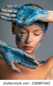 Beauty Art Portrait Of Woman With Interesting Abstract Makeup. Bright, Fashionable Color. Blue Face Paint.