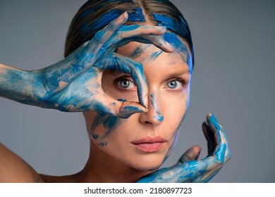 Beauty Art Portrait Of Woman With Interesting Abstract Makeup. Bright, Fashionable Color. Blue Face Paint.