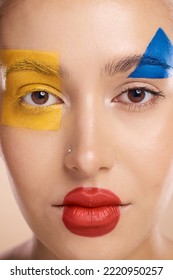 Beauty, Art And Portrait Of Woman Paint On Face, Creative Makeup And Self Expression. Skincare, Creativity And Color Block Shape Cosmetics, Empowerment And Freedom To Express For Young Beautiful Girl