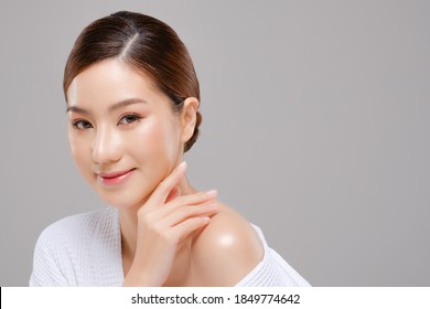 Beauty Asian Face Of The Young Beautiful Woman Skin Natural Make Up.  Close Up Face Pretty Portrait Spa And Salon In Bathing Suit Concept