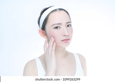 Beauty Asian Girl Who Checks Her Skin. Skin Care. Acne Treatment.