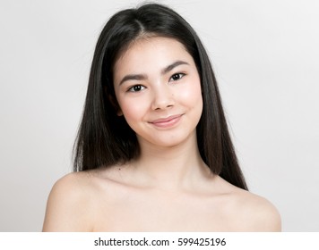 Beauty Asian Woman face Portrait. Beautiful Spa model Girl with Perfect Fresh Clean Skin. Female smiling. Youth and Skin Care Concept 