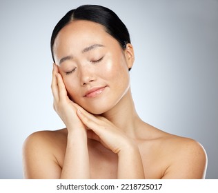 Beauty, Asian Woman And Skincare, Wellness And Makeup, Aesthetic Cosmetics Or Glowing Skin On Studio Background. Calm, Natural And Young Japanese Female Model, Clean Face And Healthy Body Dermatology