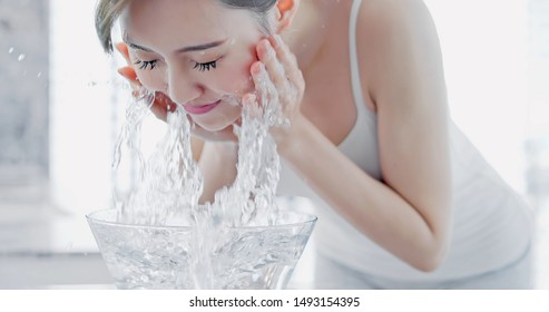 Beauty Asian Woman Wash Her Face In The Morning