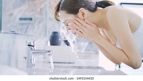 Beauty Asian Woman Wash Her Face In The Morning