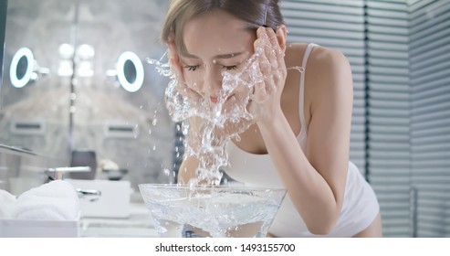 Beauty Asian Woman Wash Her Face At Night