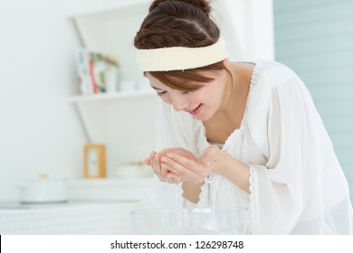 Beauty Asian Woman Washing Her Face With Clean Water