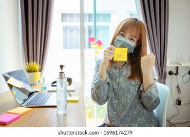 Beauty Asian Woman Wearing Mask Showing Post It The Message Is Fighting Covid To Encourage And Overcome This Crisis Coronavirus Working From Home Quarantine To Reduce The Spread Of Infection.