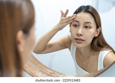 Beauty asian young woman, girl hand use water for washing on her face splashing water with soap in bathroom, cleansing in the morning before shower, clean fresh healthy skin care. Skincare relaxation. - Shutterstock ID 2229513483