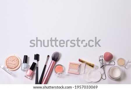Beauty background with facial cosmetic, make-up products. Free space for text, copy space. Modern layout, top view, flat lay. Make up, skin care, beauty concept.
