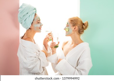 Beauty Begins From Inside. Spa And Wellness. Girls Friends Sisters Making Clay Facial Mask. Anti Age Mask. Stay Beautiful. Skin Care For All Ages. Women Having Fun Cucumber Skin Mask. Relax Concept.