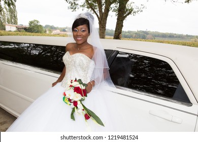 beauty black african american bride against white limousine car for marriage