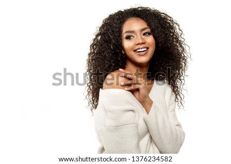 Beauty black skin woman African Ethnic female face. Young african american model with long afro hair.Smiling model isolated on white background.