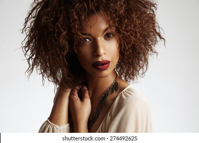 Beauty Black Woman With A Curly Hair And Red Lips