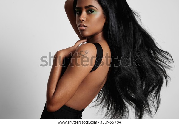 beauty\
black woman from the side with a blowing\
hair
