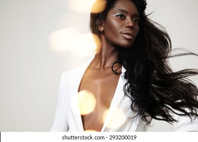 Beauty Black Woman With A Straight Blowing Hair And Bokeh