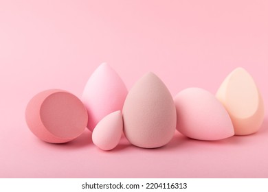 Beauty blender on a pink background.Bright sponges for make-up cosmetics. Makeup products. Beauty concept. Place for text. Space for copy. Flat lay