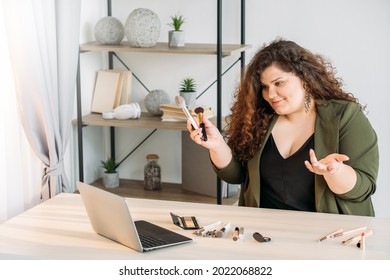 Beauty Blog. Plus Size Woman. Cosmetic Expert. Online Presentation. Body Positive. Happy Fatty Lady Testing Showing Makeup Brush Sitting Table Laptop Connection Light Room Copy Space.