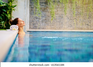 Beauty And Body Care. Sensual Young Woman Relaxing In Outdoor Spa Swimming Pool.