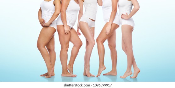 beauty  body positive   people concept    group diverse women in white underwear over blue background