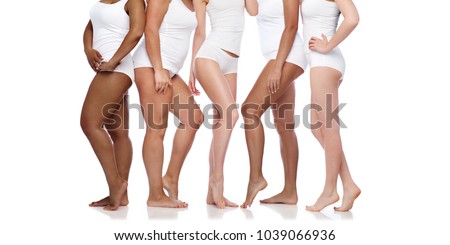 beauty, body positive and people concept - group of happy diverse women in white underwear