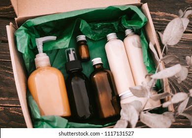 Beauty Box With Bottles Of Natural Cosmetics, Wrapped In Green Paper. Blogger Hair And Body Care Routine, Salon Treatments 