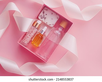 Beauty Box Subscription Package With Skincare, Spa And Makeup Cosmetic Products On Pink Background, Flatlay Design, Natural Cosmetics Gift Delivery Concept