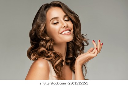 Beauty brunette girl with long shiny curly hair . Beautiful  smiling woman model  wavy hairstyle . Cosmetology, cosmetics and make-up. - Powered by Shutterstock