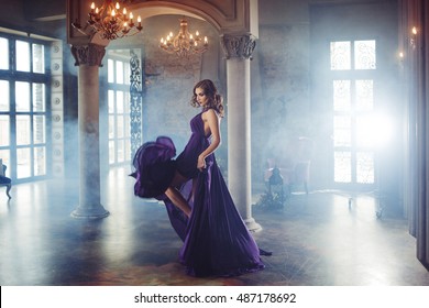 Beauty Brunette Model Woman In Evening Purple Dress. Beautiful Fashion Luxury Makeup And Hairstyle