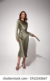 Beauty Brunette Woman Luxury Lifestyle Bright Makeup Wear Natural Organic Silk Midi Dress High Heels Perfect Body Shape Fashion Model Style For Meeting Party Or Romantic Date Studio Grey Background.