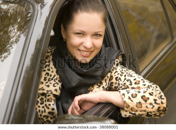 beauty businesswoman\
sitting in her car