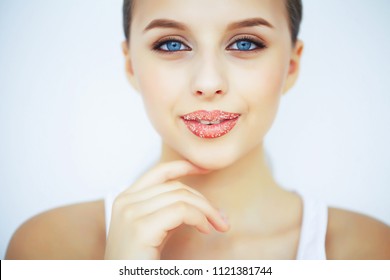 Beauty And Care. Portrait Of A Young Woman With A Beautiful Skin. Beautiful Lips. Girl Takes Care Of Lips. Woman With Beautiful Blue Eyes. Makeup. Lip Scrub. Peeling