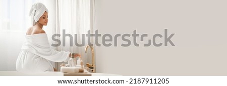Beauty Care. Relaxed Woman Enjoying Bodycare Rituals Using Cosmetics Sitting On Bathtub Wearing Bathrobe, Posing With Wrapped Towel On Head In Modern Bathroom Indoor, Panorama, Copy Space, Collage