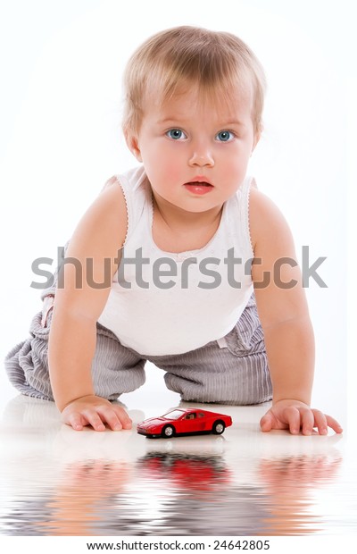 Beauty child with small red
car