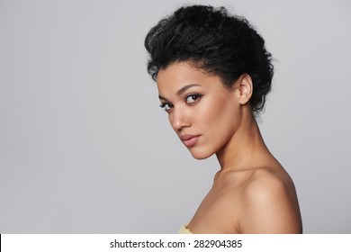 Beauty Closeup Profile Portrait Of Beautiful Mixed Race Caucasian - African American Woman Looking At Camera, Isolated On Gray Background