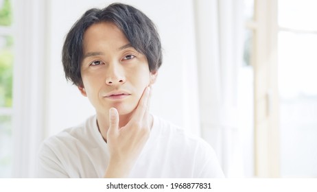 Beauty concept of asian man. Men's cosmetics.