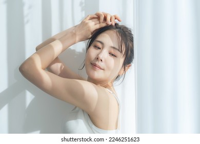 Beauty concept of an Asian woman in natural color tone. skin care.