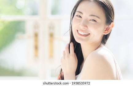 Beauty Concept Of Attractive Asian Woman. Skin Care. Hair Care.