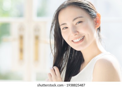 Beauty Concept Of Attractive Asian Woman. Skin Care. Hair Care.