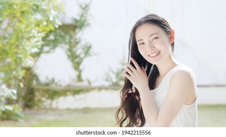 Beauty Concept Of Attractive Asian Woman. Skin Care. Hair Care.