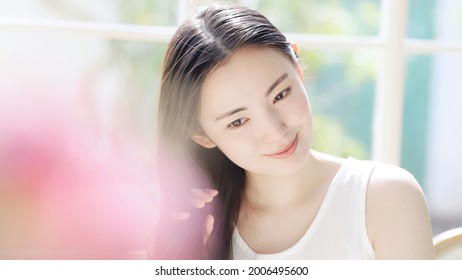 Beauty Concept Of Attractive Asian Woman. Skin Care. Hair Care.