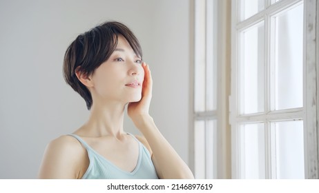 Beauty Concept Of Middle Aged Asian Woman. Skin Care. Cosmetics.