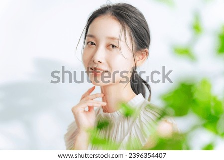 Beauty concept of middle aged Asian woman with natural makeup. Skin care. Cosmetics. Anti-aging.