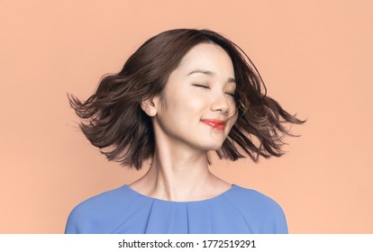 Beauty Concept Of A Young Asian Woman. Hair Care. Cosmetics.