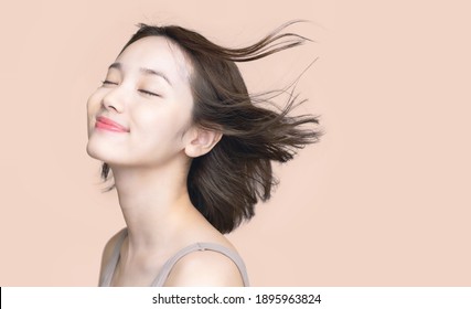 Beauty Concept Of A Young Asian Woman. Hair Care. Cosmetics.