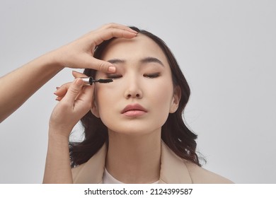 Beauty consultant concept. Beauty adviser. Cosmetic products. Professional Makeup and Beauty, isolated on white background. Beauty concept. Makeup for beautiful asian girl.
Close up, a horizontal phot