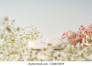 Beauty, cosmetic or perfume product presentation scene made with stone and wild summer flowers. - Shutterstock ID 2258072879